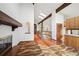 Living room with skylights, fireplace, wooden beams, tile floors and access to kitchen at 11621 Shoshone Way, Denver, CO 80234