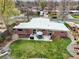 Aerial view of the home featuring a well-maintained backyard, outdoor seating, and lush greenery at 6188 S Westview St, Littleton, CO 80120