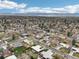 Expansive aerial view captures the home's location nestled in a tranquil neighborhood near the mountain range at 6188 S Westview St, Littleton, CO 80120