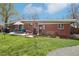The backyard featuring a grill, outdoor dining, and low-maintenance landscaping at 6188 S Westview St, Littleton, CO 80120
