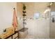 Modern bathroom featuring a tiled shower with a built-in bench, perfect for a spa-like experience at 6188 S Westview St, Littleton, CO 80120