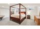 Spacious bedroom with a four-poster bed and natural light from the windows at 6188 S Westview St, Littleton, CO 80120