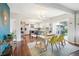 Inviting dining area flows into a modern kitchen with stainless appliances and outdoor access at 6188 S Westview St, Littleton, CO 80120