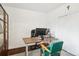 Functional home office setup with a desk, computer, and ample lighting, ideal for remote work at 6188 S Westview St, Littleton, CO 80120