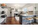 This modern kitchen features granite countertops, stainless steel appliances, and a kitchen island at 6188 S Westview St, Littleton, CO 80120