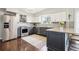 The kitchen features granite countertops, stainless steel appliances, and a stylish tile backsplash at 6188 S Westview St, Littleton, CO 80120