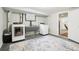 Functional laundry area equipped with a washer, dryer, and utility sink for convenience at 6188 S Westview St, Littleton, CO 80120