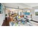 Bright and airy living space, flowing to kitchen with modern finishes and stainless appliances at 6188 S Westview St, Littleton, CO 80120