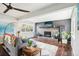Cozy living room with fireplace, hardwood floors, and bright natural light at 6188 S Westview St, Littleton, CO 80120