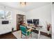 Cozy home office with natural light, wood floors, and custom display cabinet at 6188 S Westview St, Littleton, CO 80120