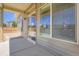 An outdoor seating area with sliding glass doors looking out to a fenced yard at 3130 Hardin St, Castle Rock, CO 80109