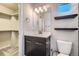 Modern bathroom boasts dark cabinets, a toilet, and a walk-in closet at 3130 Hardin St, Castle Rock, CO 80109