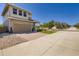 View of the home's exterior highlighting the driveway and landscaping at 3130 Hardin St, Castle Rock, CO 80109