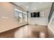 Inviting living room boasting sleek floors, natural light, and a media entertainment setup at 3130 Hardin St, Castle Rock, CO 80109