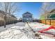 Backyard with detached garage and pathway at 2728 Renshaw St, Strasburg, CO 80136