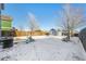 Spacious backyard with wooden fence, shed, and play area at 2728 Renshaw St, Strasburg, CO 80136