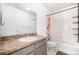 Clean bathroom with tub, shower, and updated vanity at 2728 Renshaw St, Strasburg, CO 80136