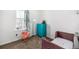 Charming bedroom with window, dresser, and crib at 2728 Renshaw St, Strasburg, CO 80136