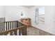 Bedroom with crib, dresser, and window at 2728 Renshaw St, Strasburg, CO 80136