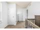 Well-lit bedroom with closet and door access at 2728 Renshaw St, Strasburg, CO 80136