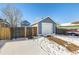 Detached garage with single car door in winter at 2728 Renshaw St, Strasburg, CO 80136