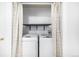 Convenient laundry closet with washer and dryer at 2728 Renshaw St, Strasburg, CO 80136