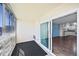 Enclosed balcony with large windows leads into the kitchen at 350 S Clinton St # 8C, Denver, CO 80247