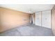 Spacious bedroom with neutral color walls, ceiling fan and carpet at 350 S Clinton St # 8C, Denver, CO 80247