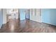 Bright and airy living room adjacent to kitchen area and built-in shelving unit at 350 S Clinton St # 8C, Denver, CO 80247