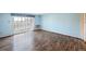 Light blue living room with sliding doors leading to the outdoor balcony at 350 S Clinton St # 8C, Denver, CO 80247