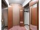 Storage with mirrors, shelving, and pink carpet at 350 S Clinton St # 8C, Denver, CO 80247