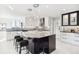 Modern kitchen with granite countertops and island seating at 1133 Race St # 8 & 9 B, Denver, CO 80206