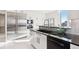 Modern kitchen with stainless steel appliances and dark cabinetry at 1133 Race St # 8 & 9 B, Denver, CO 80206