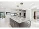 Bright kitchen featuring a center island with a stone countertop and modern pendant lighting at 1133 Race St # 8 & 9 B, Denver, CO 80206