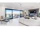 Bright living room with balcony overlooking city views and fireplace at 1133 Race St # 8 & 9 B, Denver, CO 80206