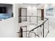 Modern staircase with glass railings and white walls at 1133 Race St # 8 & 9 B, Denver, CO 80206