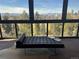 Bright sunroom with floor-to-ceiling windows showcasing stunning views of the city skyline and greenery at 1133 Race St # 8 & 9 B, Denver, CO 80206