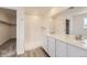 Bright bathroom with double sinks, a large mirror, and a clean, modern shower at 22014 E 39Th Ave, Aurora, CO 80019