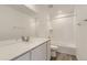 Clean bathroom features white cabinets, quartz countertop and shower/tub combo at 22014 E 39Th Ave, Aurora, CO 80019