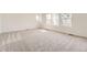 Inviting bedroom featuring soft carpet and large windows for ample natural light at 22014 E 39Th Ave, Aurora, CO 80019