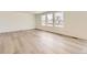 Bright living room with beautiful wood floors and large windows offering plenty of natural light at 22014 E 39Th Ave, Aurora, CO 80019