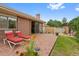 A brick patio with lounge chairs offers a relaxing outdoor space in this well-maintained backyard at 2800 S University Blvd # 1, Denver, CO 80210