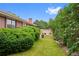 A lush, green backyard features neatly trimmed bushes and landscaping for a serene outdoor experience at 2800 S University Blvd # 1, Denver, CO 80210