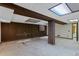 Unfinished basement space with exposed beams, wood paneling, and plenty of potential at 2800 S University Blvd # 1, Denver, CO 80210
