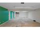 Unfinished basement offering a blank canvas with whitewashed walls and natural light at 2800 S University Blvd # 1, Denver, CO 80210