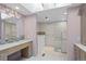 Modern bathroom with dual sinks, tiled walk-in shower, and a luxurious soaking tub at 2800 S University Blvd # 1, Denver, CO 80210