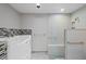 Bright bathroom featuring a glass shower, and a stylishly tiled soaking tub at 2800 S University Blvd # 1, Denver, CO 80210