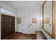 Elegant entryway featuring beautiful wood doors, tiled floors, and sophisticated decor at 2800 S University Blvd # 1, Denver, CO 80210