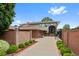 Spacious home with well-maintained landscaping and brick accents along the entryway and perimeter at 2800 S University Blvd # 1, Denver, CO 80210