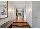 Grand foyer with decorative wallpaper, sconces, hardwood floors, and skylight that enhances its spacious design at 2800 S University Blvd # 1, Denver, CO 80210